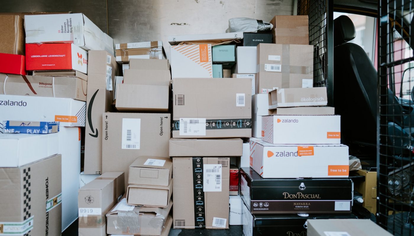 brown cardboard boxes on black plastic crate