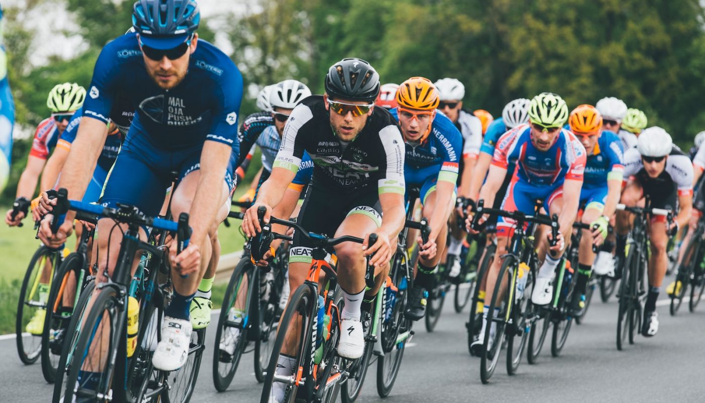 group of cyclist on asphalt road