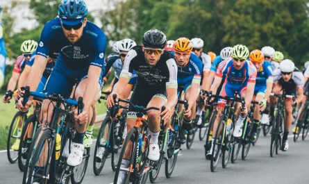 group of cyclist on asphalt road